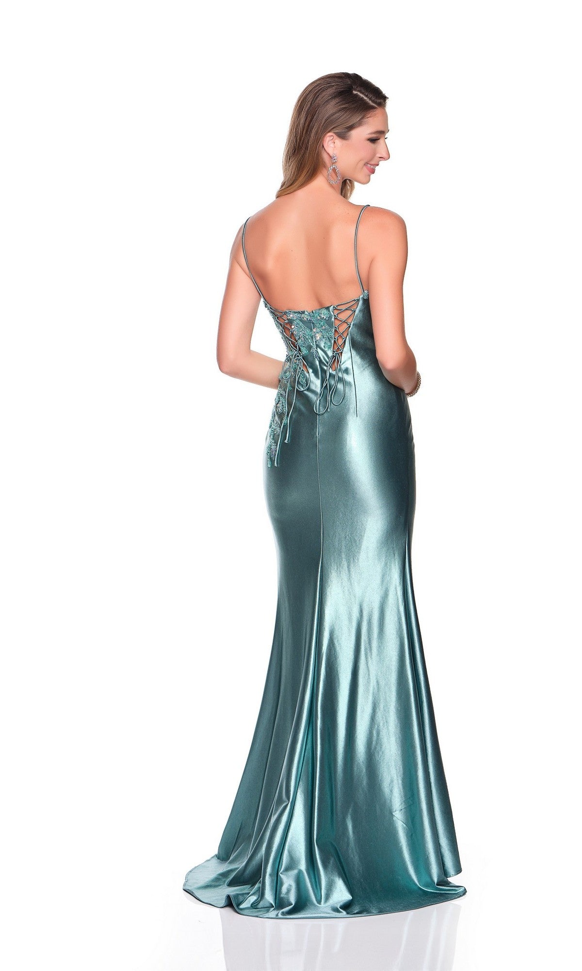 A woman models the Dave and Johnny 12428 long prom dress in shiny teal satin, featuring thin straps and a lace-up back, standing against a plain white background with her back to the camera.